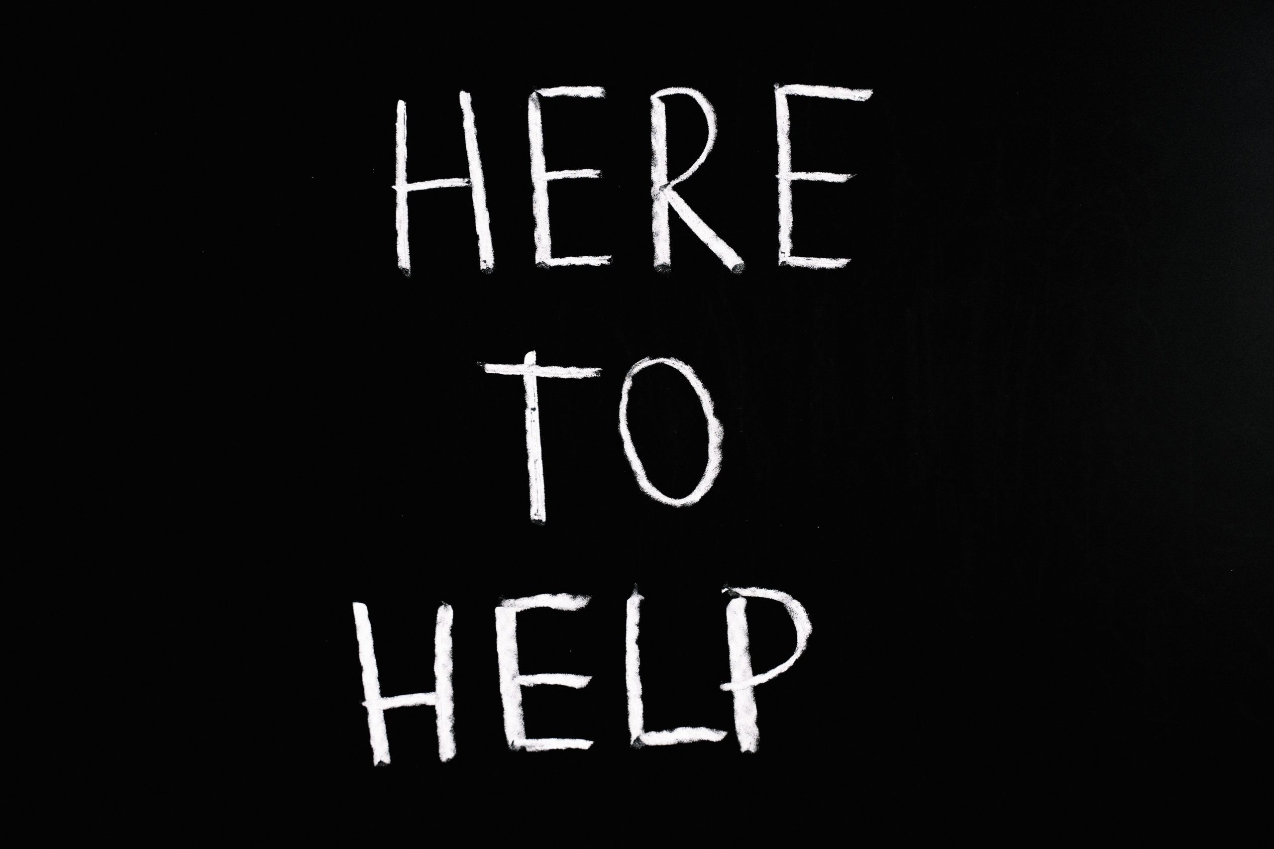 "here to help" written in chalk