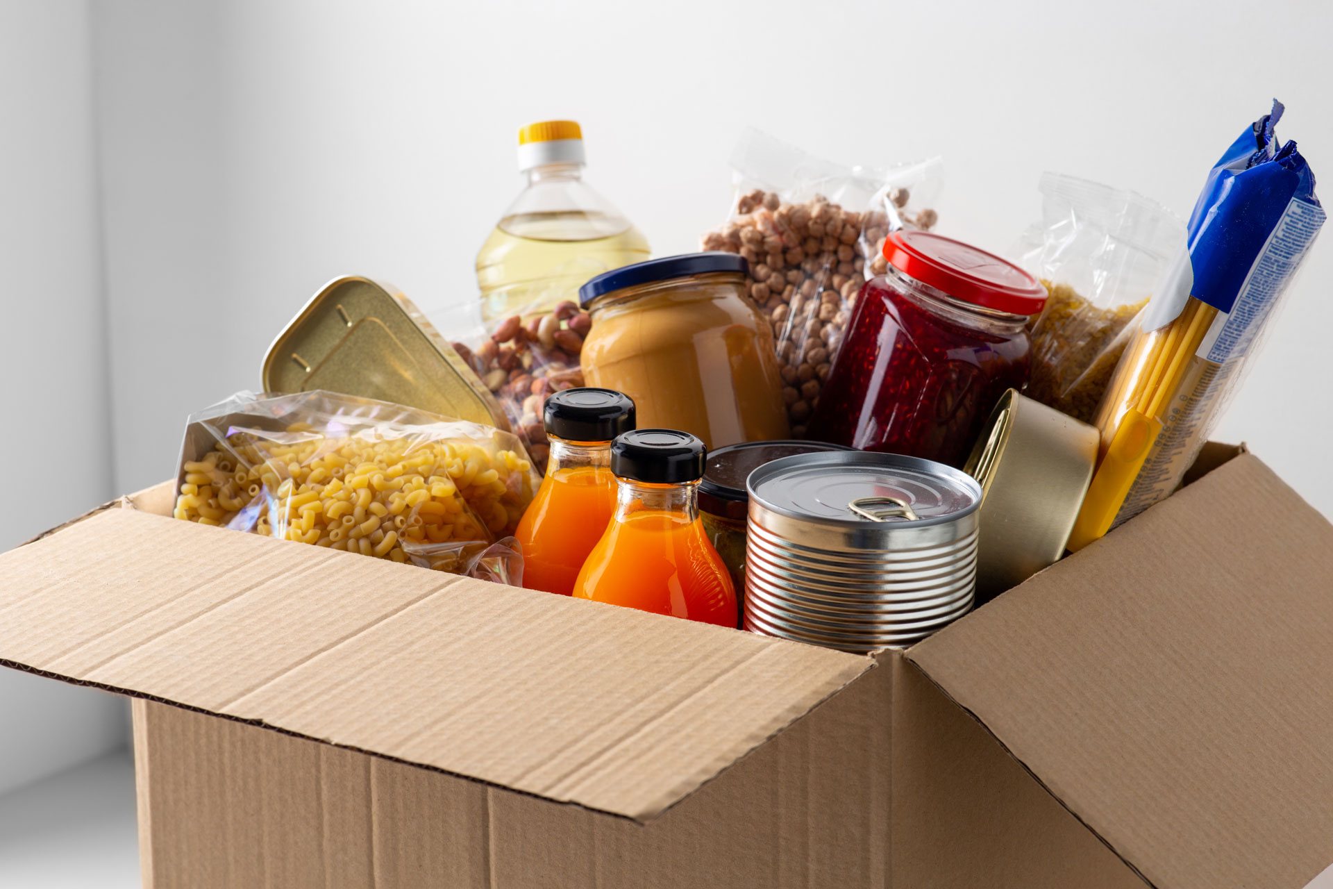 dry goods and canned food in cardboard box